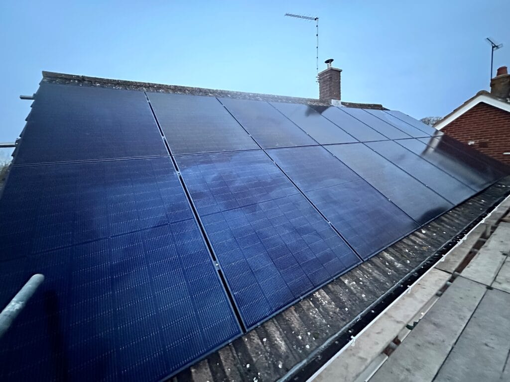 Roof-mounted solar panels under clear sky